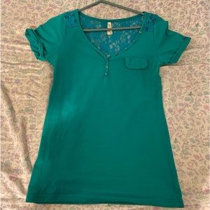 Teal short sleeve shirt.